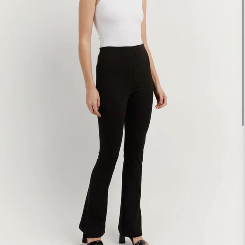 DISSH Black stretch knit flare pants with side slit